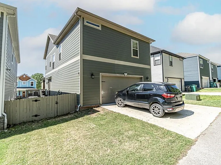 Back of house and 2 car garage