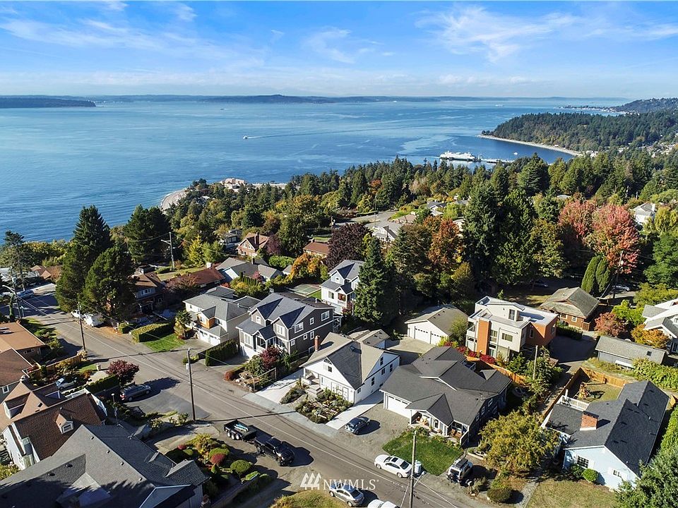 Old world charm and modern updates abound in this spacious remodeled home with peek a boo water and mountain views in the Marine View area