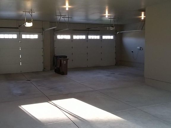 Double deep garage holds 4+ cars, workspace and toys