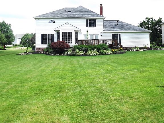 Large backyard with a deck