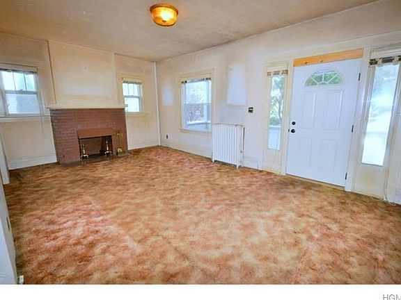 Living room wood burning fireplace.