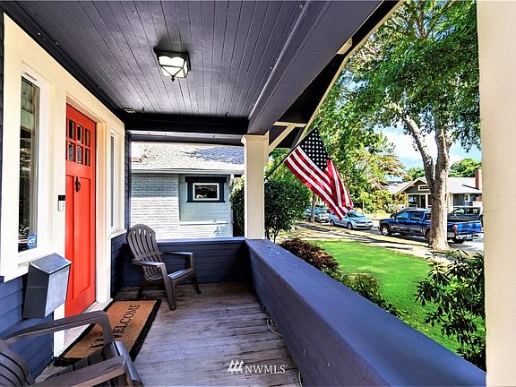 Large front porch ready for outside discussions or watching the world meander by....