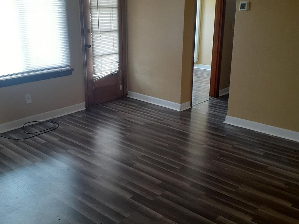 Living area, looking from doorway in. With door that access the balcony.