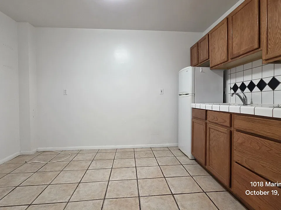 Kitchen comes with a fridge and range