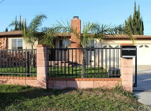 Front of the house with iron fence
