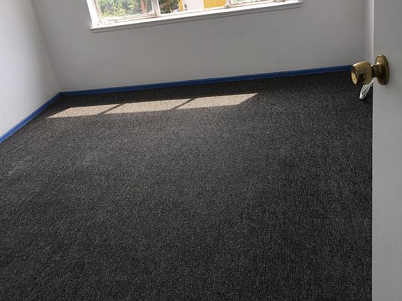 newly painted room+ rugs