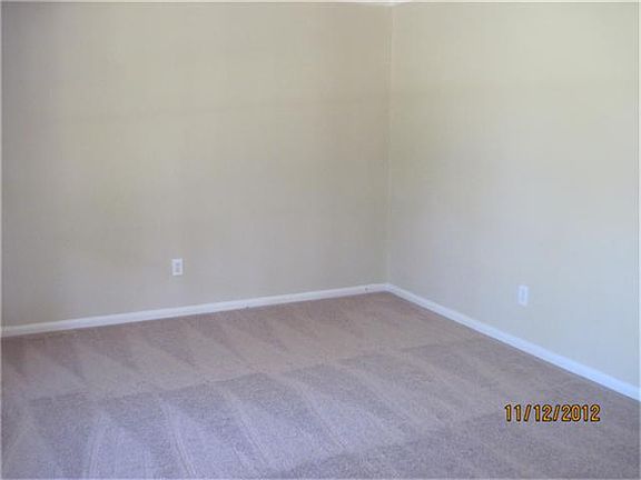 Living Area with new carpet and fresh paint