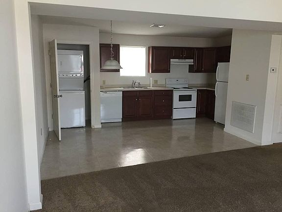 Kitchen with cherry cabinets and new appliances