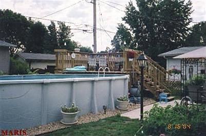 Enjoyable, low maintenance pool with built-in bar, patio, gazebo, and deck.