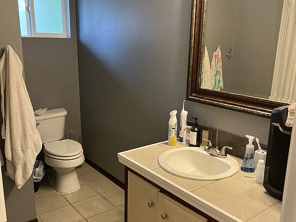 Shared full bath, shower and tub is on the left.