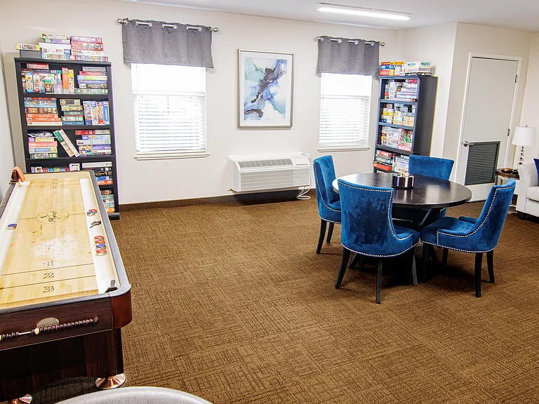 Active resident gathering space perfect for puzzles, card games, shuffleboard, and social activities
