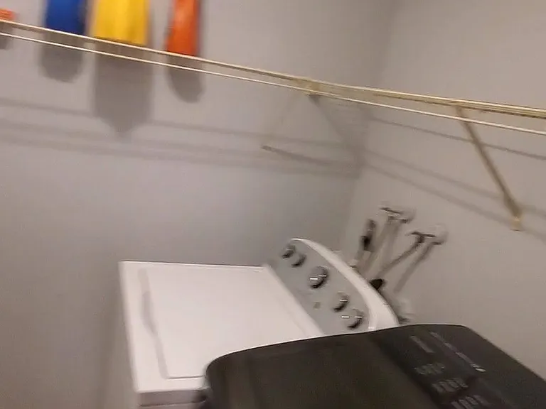 Laundry room, washer and new dryer.