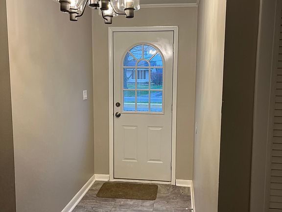 Newly tiled foyer with new lighting