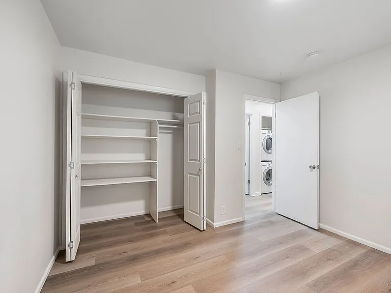 Upper floor Room 2 with good size closets and shelving