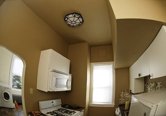 kitchen with gas stove, microwave and fridge