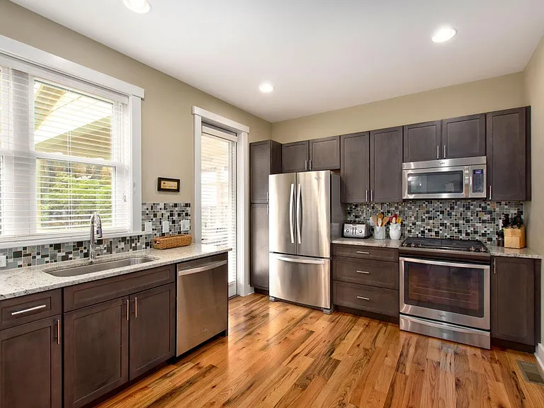 Spacious Kitchen with Gas Range Has Plenty of Cabinets and a