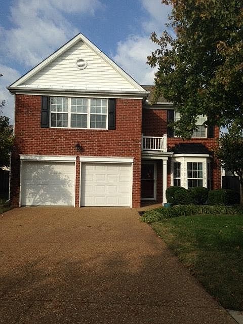 Front of the brick home.