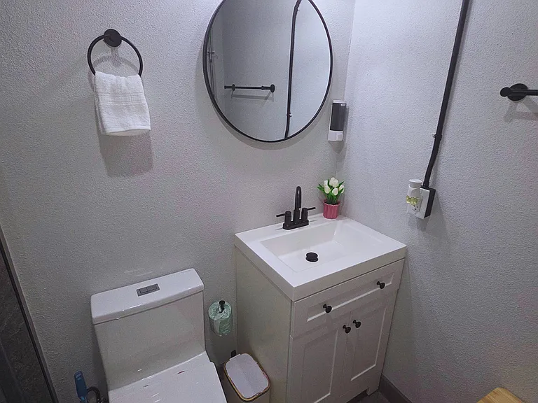 Contemporary bathroom with modern shower & spotless toilet