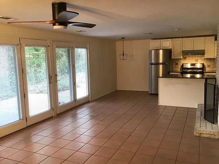 large living space- kitchen- fireplace