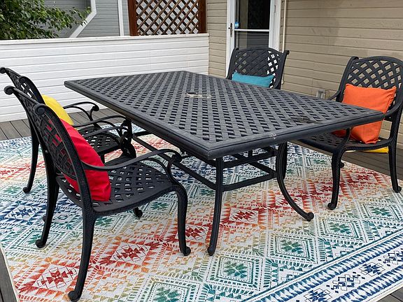 Upper deck with furniture included (rug and colored cushions excluded). Yellow awnings pull out for shade on sunny days.