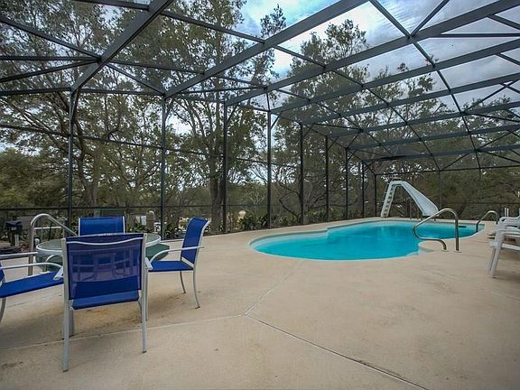 SLIDE HAS BEEN REMOVED. Pool with seating area.