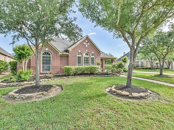 Mature Trees and Professional Landscaping add to the Curb Appeal of this meticulously maintained home.