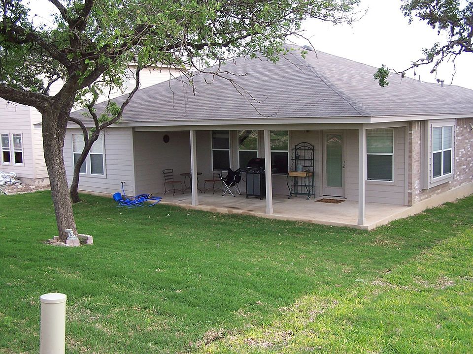 view of backyard and covered porch