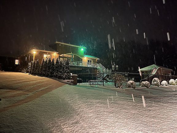 Back view of house in snow 