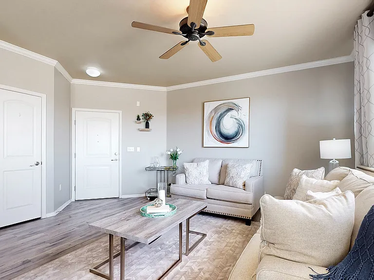 Relax in this beautifully styled living room, where comfort meets elegance.