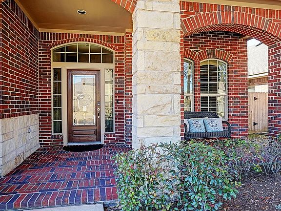 Sit, relax, and watch the world go by from this charming covered brick porch. Your guests will feel welcomed before they even enter.