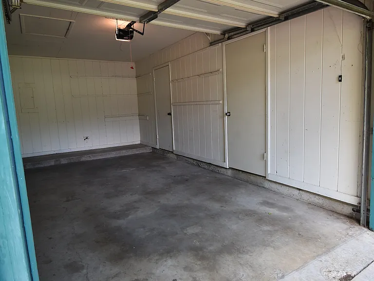 Shared garage where you can park one car. There's also space for a second car in the driveway.