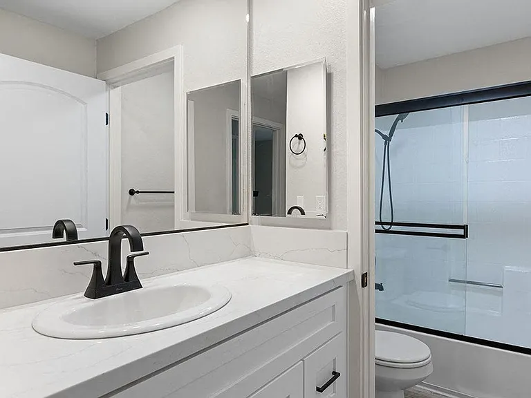 Modern styled bathroom with shower and tub.