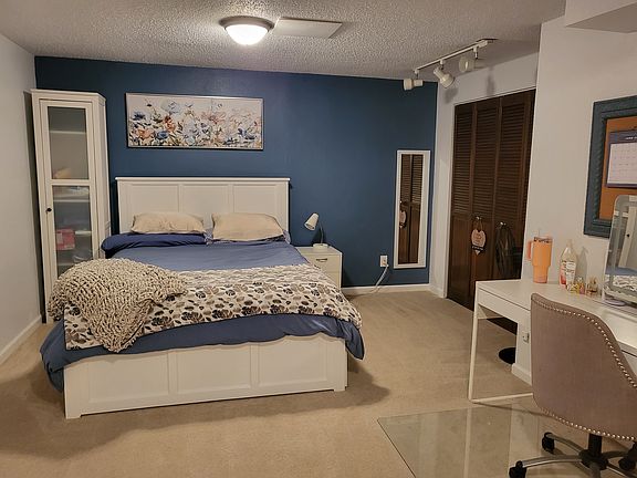 Basement Bedroom 
New queen bed with twin trundle (Sleeps 3)
Desk w/office chair and computer monitors 
T.V., recliner, end tables, mirror, lamps, storage cabinets and bookshelf. 
(Freshly painted)