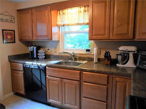 Nicely updated kitchen includes dishwasher, microwave, gas stove and refrigerator.