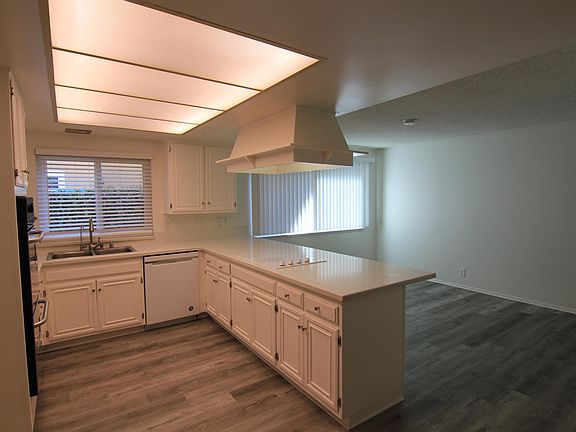 Kitchen looking out to dining area just past the breakfast bar.