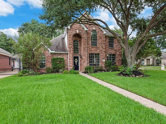 The curb appeal of this home situated on a corner lot is stately.