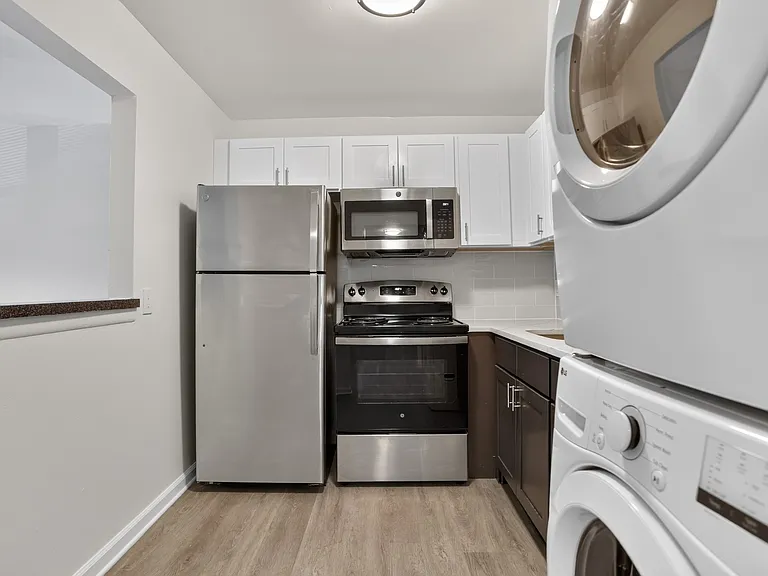 Elevate your lifestyle at Miry Run Apartments with this stylish kitchen featuring modern appliances and sleek cabinetry. Enjoy convenience and comfort in an inviting space. Schedule a tour today to see it in person!