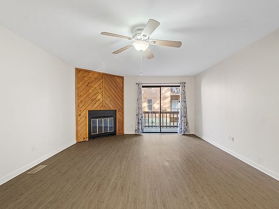 Large living / dining room with wood burning fireplace