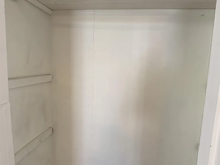2nd smaller closet, can be used for hanging clothes or shelves/linens. Has power & cable hook-up.