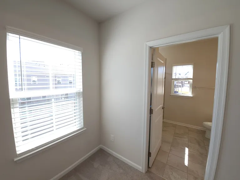 MASTER BED ROOM FULL BATHROOM WITH A WINDOW
