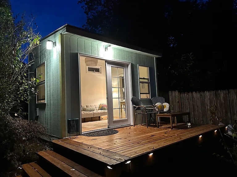 Adorable, brand new backyard sanctuary office with its own deck, two desks and a couch. Fully insulated, Internet line run from the house, and with its own mini split for air-conditioning and heat.