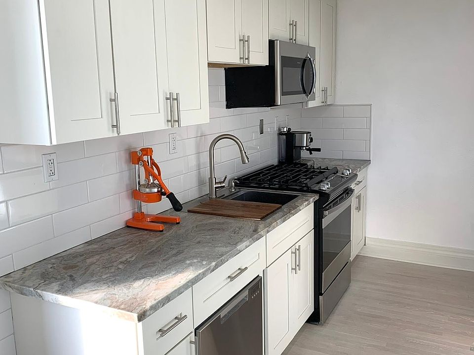 Sample preview: Same Tall cabinets /crown molding, granite and hardwood French Oak finish that we do in all of our apartments.