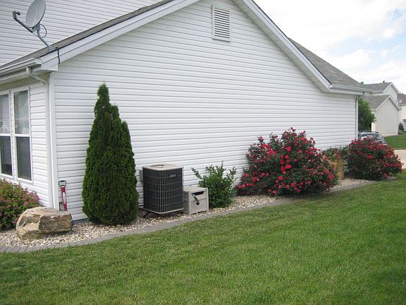 professional landscaping that continues around the side of the house
