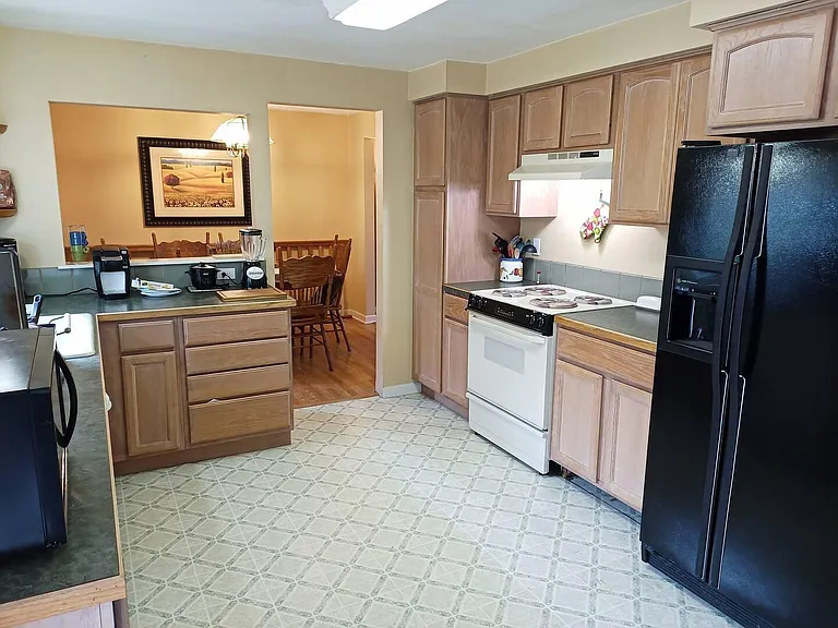 open kitchen with dining room in background