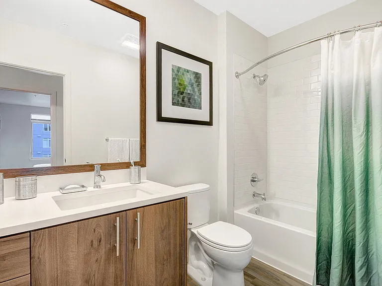 Extended vanity with custom, wood framed mirrors in each bathroom