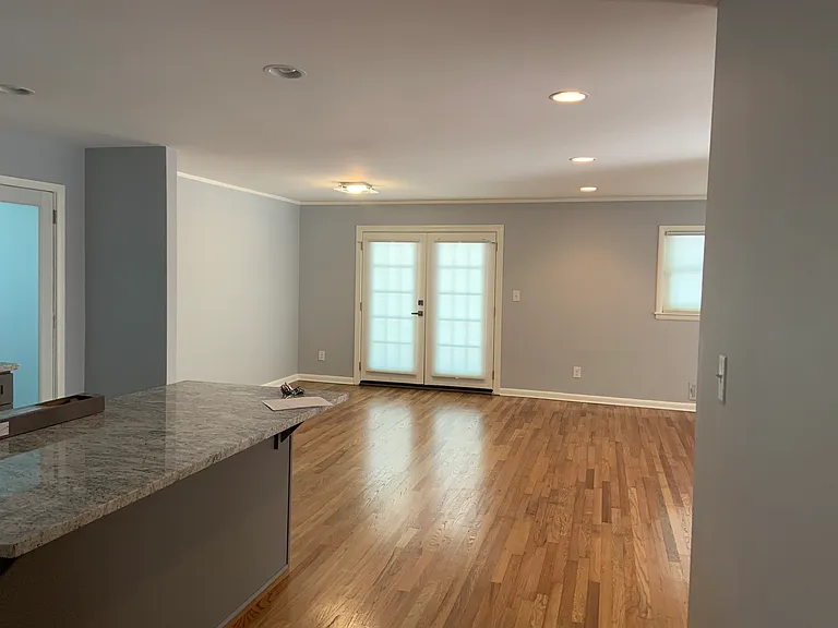 French doors lead to the outside generously sized deck. Hardwood floors.