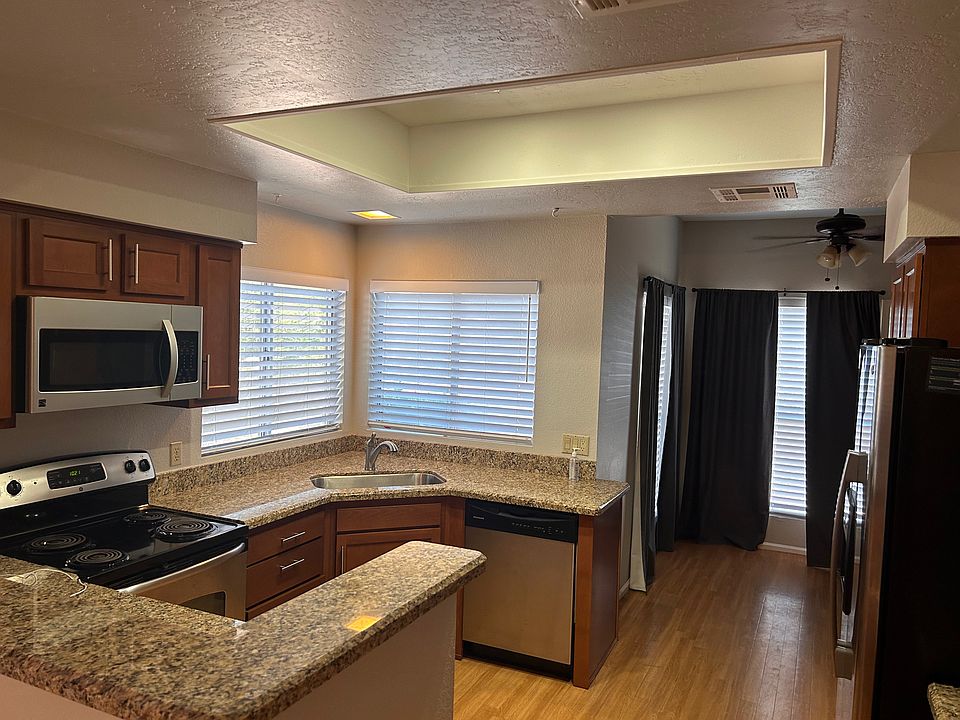 kitchen and bonus office space with washer dryer and door to parking