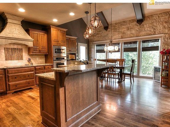 Gourmet kitchen with stone accents