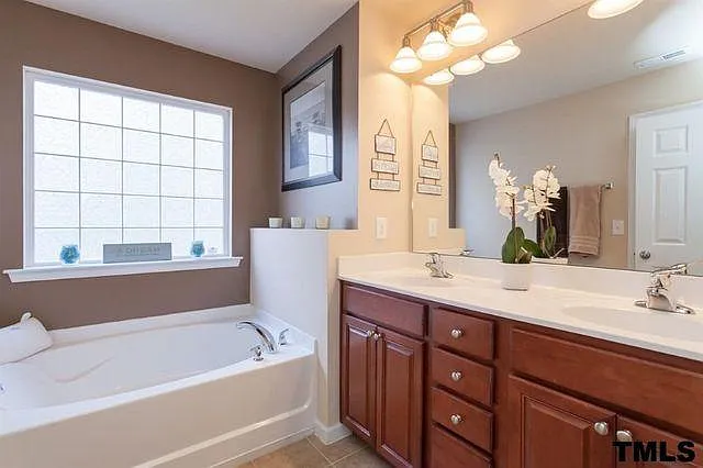 Master bath with tb. Master bath has standing shower as well (not shown in this pic)
