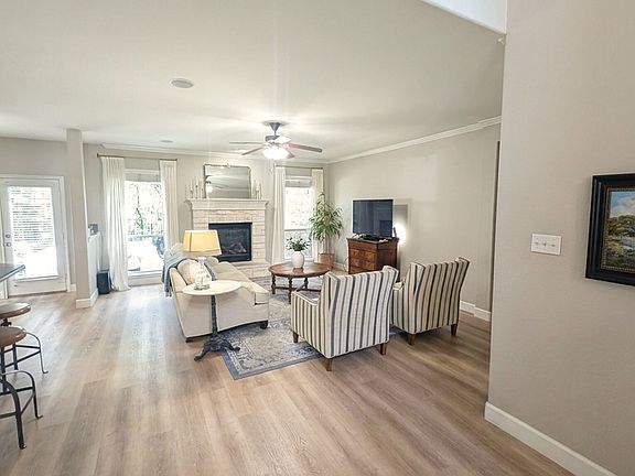 Living room with gas fireplace and soaring vaulted ceilings